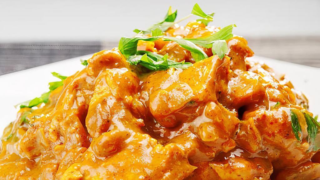 Curry Chicken · Sliced white meat chicken with carrots, diced bell pepper, and onions stir-fried in a yellow curry sauce.