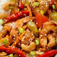 Kung Pao Shrimp · Shrimp with zucchini, celery, and carrots stir-fried in a spicy kung pao sauce topped with p...