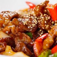 Szechuan Pork · Pork strips with carrots, mushrooms, diced bell pepper, and onions stir-fried in a spicy Sze...