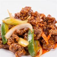 Mongolian Beef · Tender sliced beef with bell pepper, onion, and carrots stir-fried in a spicy Mongolian sauce.