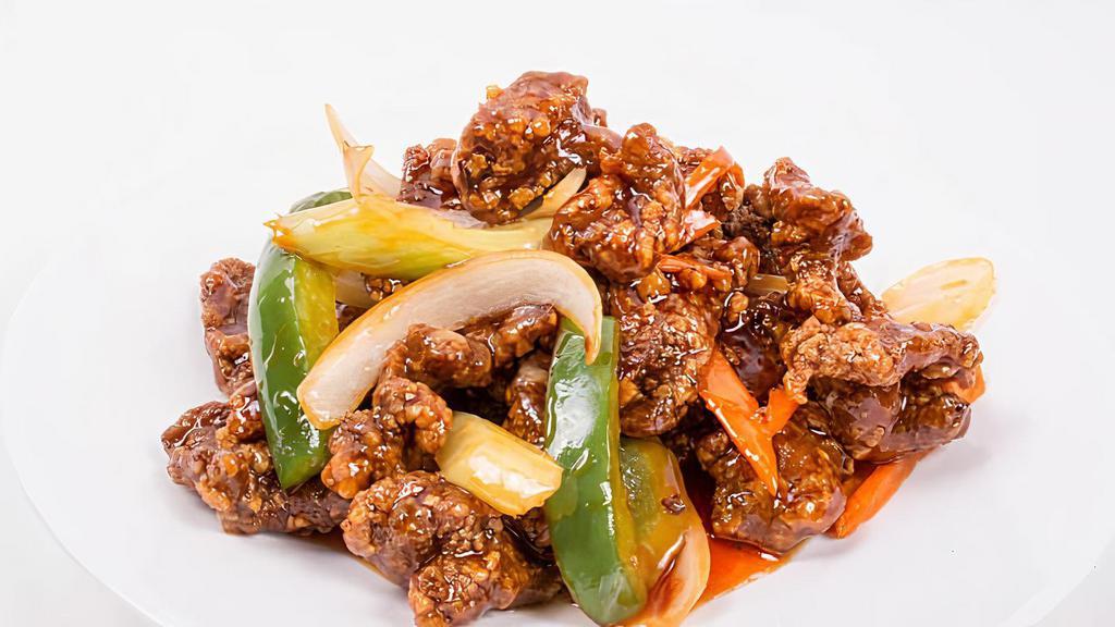 Mongolian Beef · Tender sliced beef with bell pepper, onion, and carrots stir-fried in a spicy Mongolian sauce.