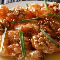 Honey Walnut Shrimp · Crispy shrimp over lettuce glazed with honey walnut sauce topped with walnut.