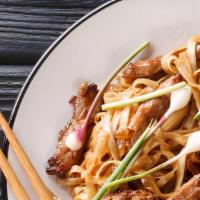 Beef Chow Fun · White flat rice noodle with bean sprouts green onions wok stir-fried in soy sauce.