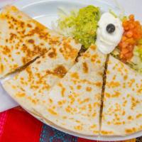 Super Quesadilla · Filled with your choice of meat, cheese, tomatoes & lettuce. Served with guacamole and sour ...