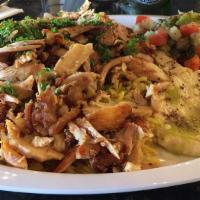 Chicken Shawarma Plate · 1/2lb marinated chicken shaved off the spit.  (the plate comes with rice, Arabic salad, huma...