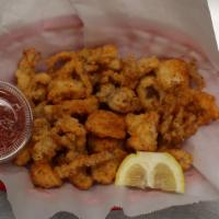 Fried Calamari  · Hand cut calamari w/ tenticles lightly battered. Served w/ Spicy marinara sauce.