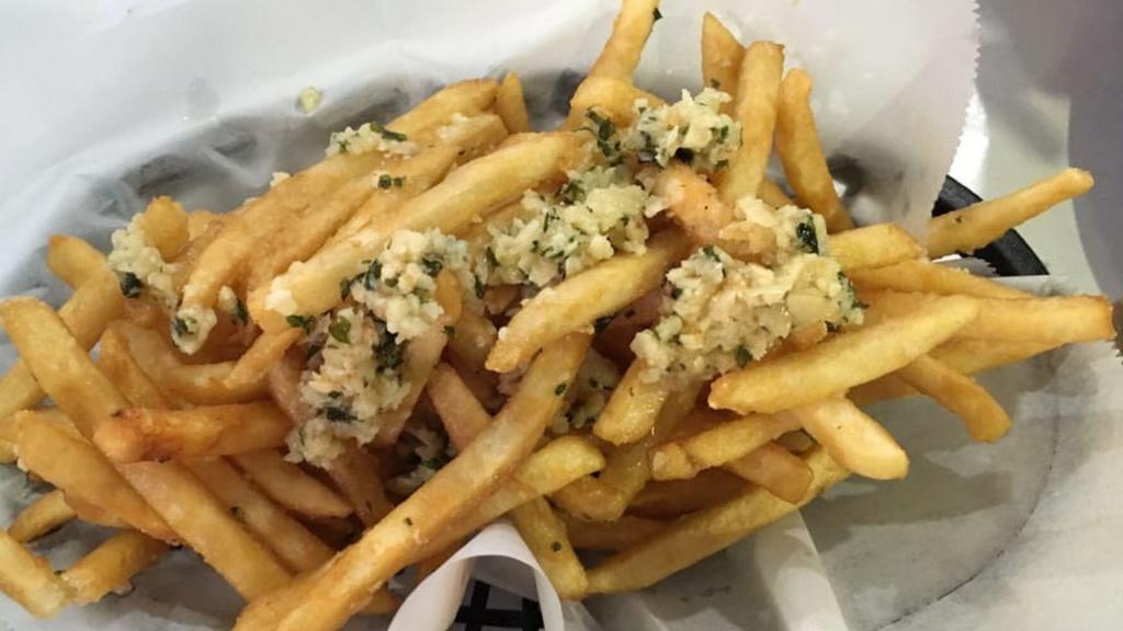 Garlic Fries  · Crispy golden fries tossed in our signature garlic seasoning.