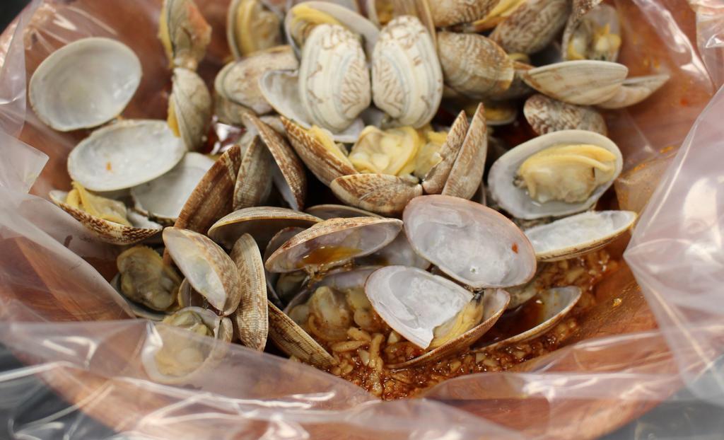 Clams · One pound of Manila clams cooked in your favorite sauce.