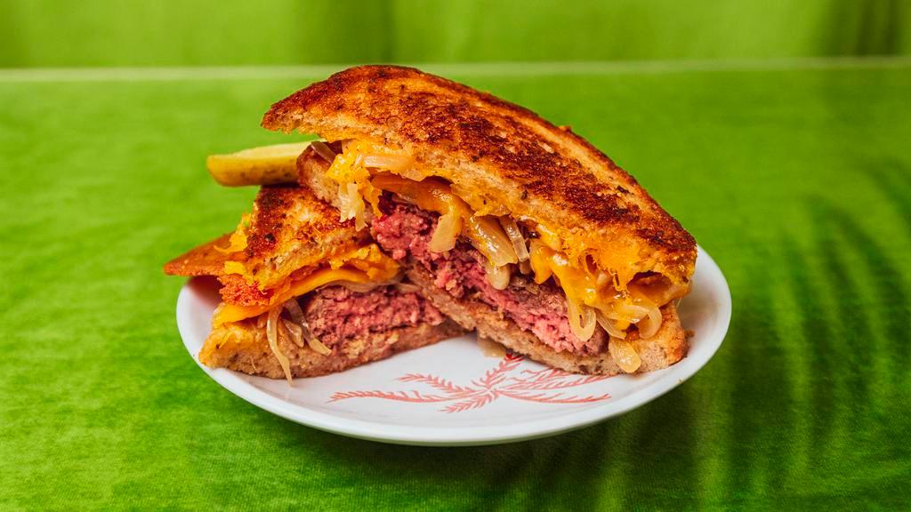 Patty Melt · House-ground beef burger with swiss cheese, caramelized onions served on sourdough.
