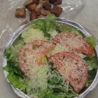 Caesar Salad · Romaine lettuce, tomato, shredded Parmesan cheese, and croutons.