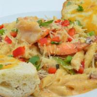 Louisiana Cajun Pasta · Penne Pasta served with fresh peppers, onions, andouille sausage, shrimp, diced chicken, ser...