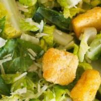 Caesar Salad · Crispy romaine lettuce, parmesean cheese, crutons & caesar dressing. - with chicken +$2.50
