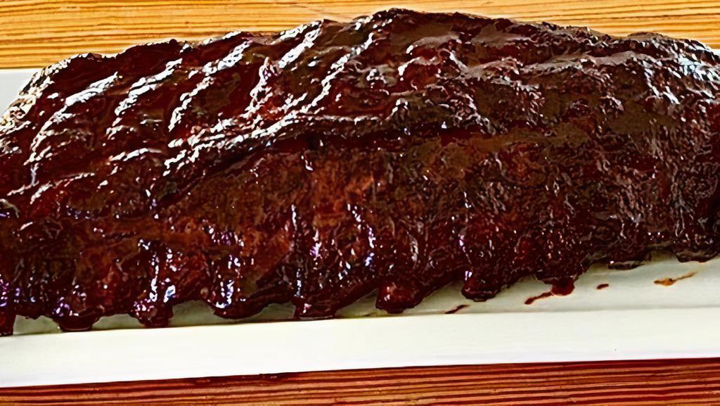 Full Rack Ribs · A WHOLE SLAB OF OUR SIGNATURE BBQ RIBS! SERVED WITH TWO SIDES OF YOUR CHOICE!