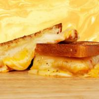 Grown Up Grilled Cheese · Melted cheddar, mozzarella, and jack cheese between two slices of buttery grilled bread.