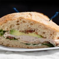 Turkey Avocado Sandwich · Popular. Roasted turkey, smoked bacon, avocado, green leaf lettuce, tomato and house aioli o...