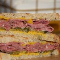 Lean Pastrami On Rye Sandwich · Prime lean pastrami, pickle and mustard.