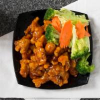 . Orange Chicken · Golden crispy fried chicken tossed in orange sweet and sour sauce, carrots, bell peppers, on...
