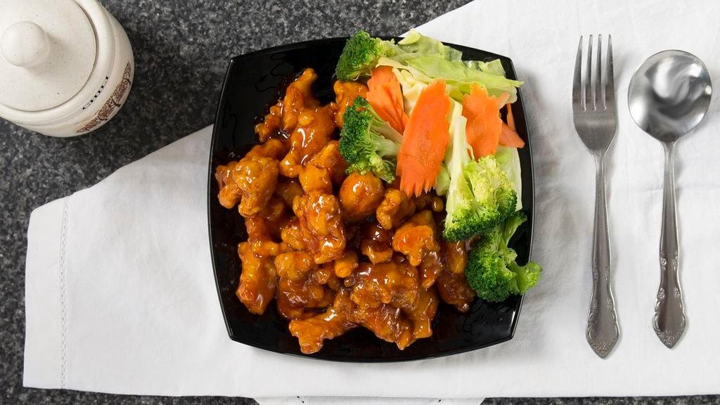 . Orange Chicken · Golden crispy fried chicken tossed in orange sweet and sour sauce, carrots, bell peppers, onions in special house sauce. Served with white rice.