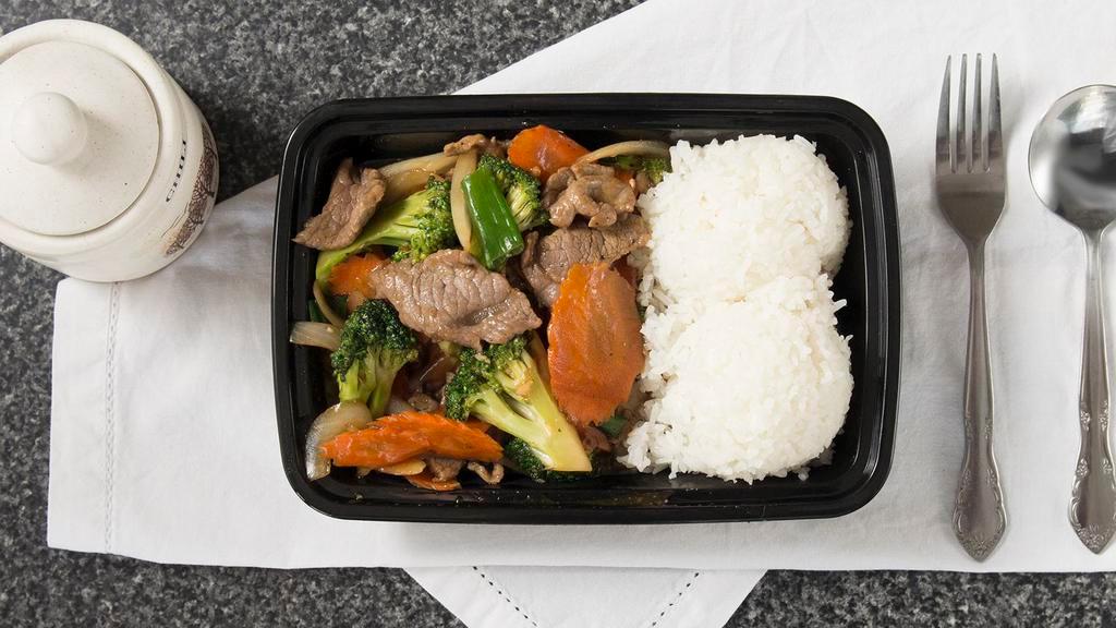 Beef And Broccoli · Stir fried beef with broccoli, carrots, garlic, onions, carrots. Served with steamed, white rice