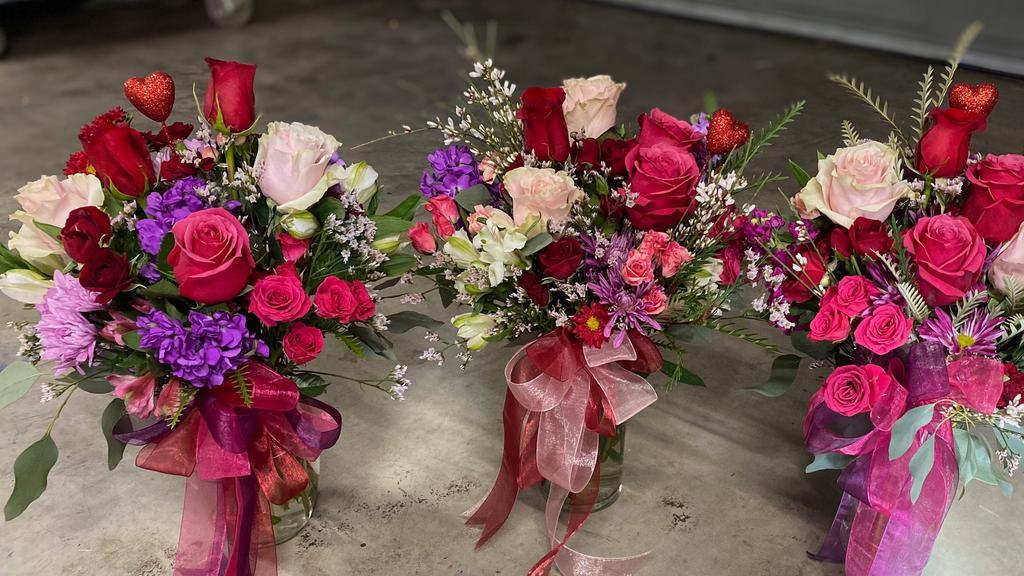 Mixed Valentine Bouquet · Mix it up! 
These bright and festive mixed flowers will be sure to make someone smile! 
Flowers and colors will vary from photos. They will have a few roses mixed in.