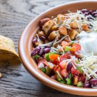 The Ultimate Burrito Bowl · Rice and beans, your choice of meat, topped with fresh pico de gallo, lettuce, cheese, and o...
