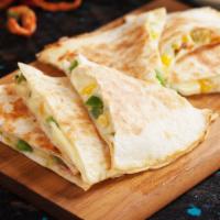 Veggie Lovers Quesadilla · Grilled veggies mixed in with melted cheese with a side of pico de gallo and sour cream.