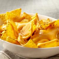 Cheesy Cheese Nachos · Your fresh tortilla chips topped off with nacho cheese sauce.