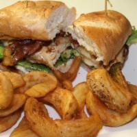 California Club Sandwich · Grilled chicken breast, garlic aioli, smoked bacon, Monterey jack cheese, butter lettuce, to...