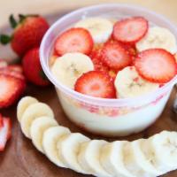 Strawberry Banana Pudding · Vanilla pudding topped with chessman cookies, fresh sliced strawberries & strawberry crumble.