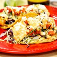Grilled Shrimp Taco · Cabbage, salsa Mex, chipotle sauce, and queso fresco.