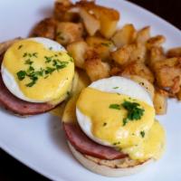 Eggs Benedict. · two poached eggs, canadian bacon, hollandaise sauce, english muffin & side of house potato