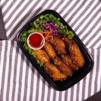 Golden Wings · Deep-fried fish sauce chicken wings.