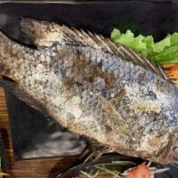 Grilled Fish · The authentic Thai grilled fish. Coated in a thick layer of salt and slow roasted over charc...