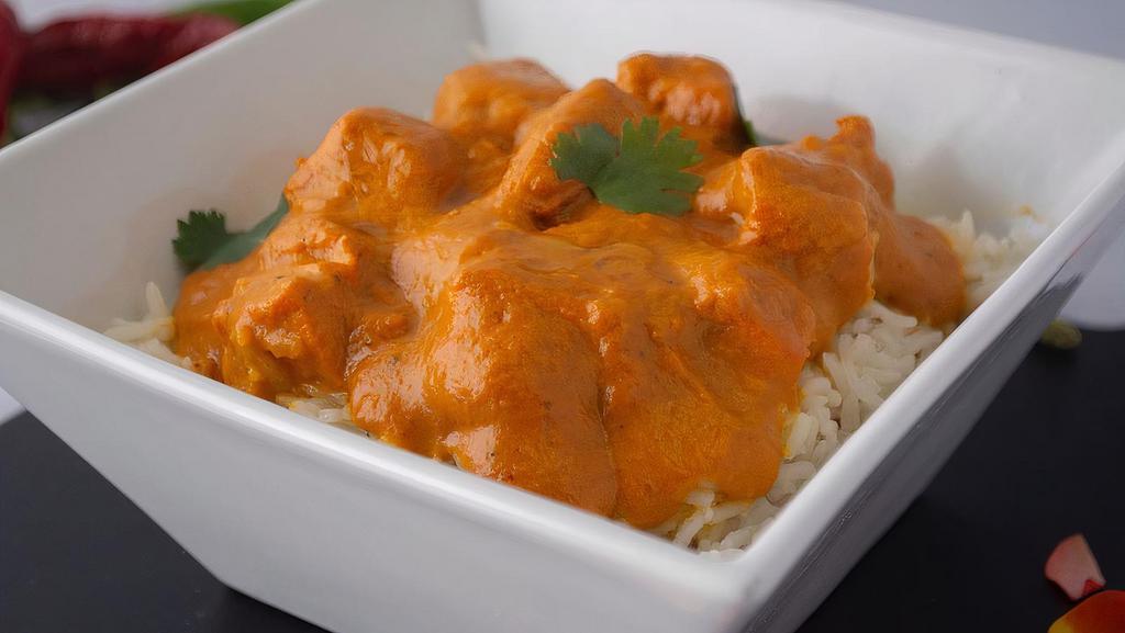 Butter Chicken Bowl · Tandoori chicken pieces, slowly cooked in butter and tomato gravy with spices and herbs. Served with rice, an appetizer, and salad!