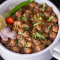 Chana Masala Bowl · Garbanzo beans cooked with fresh tomatoes, ginger and garlic, Indian herbs and spice. Served...