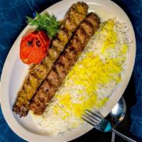 Beef Koobideh · Two skewers of juicy seasoned ground beef. Entrées with are served with a flame broiled toma...