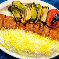 Shish Kabob · Thick chunks of marinated beef tenders skewered with onions, tomatoes, and green bell pepper...