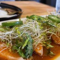 Salmon Bite · Raw salmon, white onions, cucumber stirred with housemade sauce topped with alfalfa, cilantr...