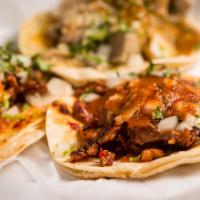 Regular · Choice of meat, onion cilantro & salsa on a soft tortilla.