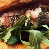 Fig Burger · HERBED GOAST CHEESE, ARUGULA, TOMATO, CARAMELIZED ONIONS, FRESHLY MADE FIG SPREAD, BRIOCHE BUN