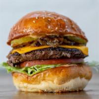 The Classic Burger · American cheese, pickles, lettuce, tomato, caramelized onions, burger shop dressing.