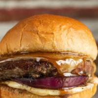The Signature Burger · White Cheddar, Charred red onion, Creole aioli and Demi Glaze.