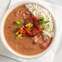 Red Beans And Rice Appetizer · 8 oz cup A New Orleans classic of creamy red beans cooked with bacon fat, served with rice a...