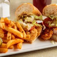 Fried Shrimp Po Boy · Shrimp in a light seasoned flour, flash fried. Topped with Lettuce, Tomato, pickles, and Rem...