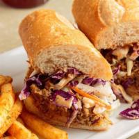Pulled Pork Po Boy · House smoked pork shoulder, pulled, topped with house-made coleslaw, and BBQ sauce infused m...