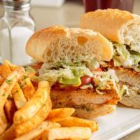 Fried Catfish Po Boy · Catfish filet in a light cornmeal and flour crust, flash fried. Topped with lettuce, tomato,...