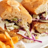 Blackened Catfish Po Boy · Pan seared catfish filet dusted with Creole seasoning, topped with shredded cabbage, and hou...