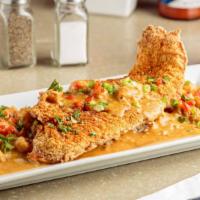 A Taste Of New Orleans · Crawfish Etouffee over rice and laced with a ribbon of house-made Tartar sauce, topped with ...