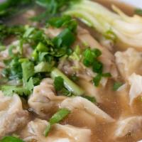 Wonton Noodle Soup · Homemade wontons with noodles in slow cooked beef broth.