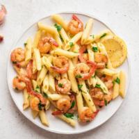 Shrimp Scampi Penne Pasta · Wild-caught shrimp smothered in lemon, herbs, and garlic sauce.